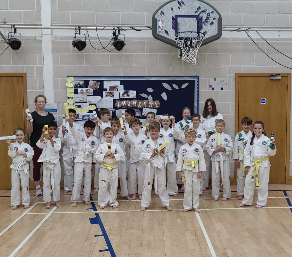 Group photo of students who passed coloured belt grading 